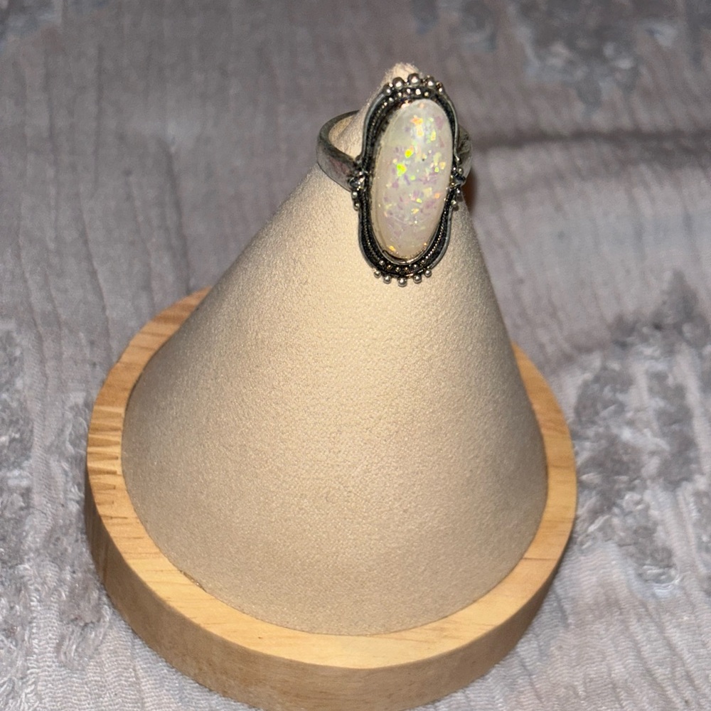 Silver ring with opal stone.
Size 8
